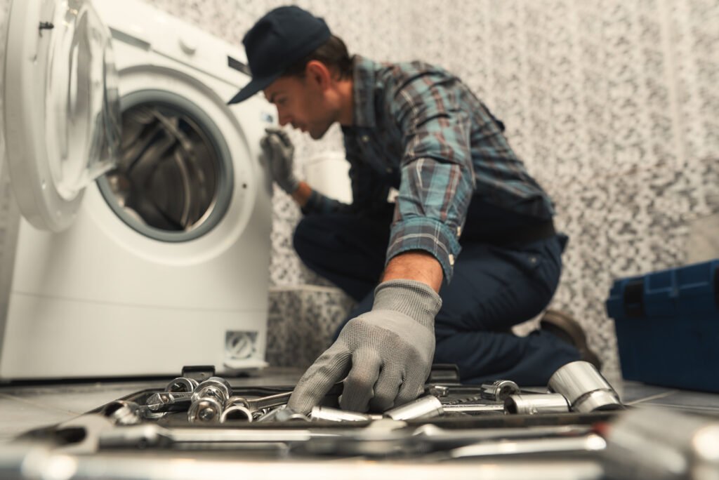 Centrix Appliance Technician diagnosing a washer not draining due to a suspected pump blockage